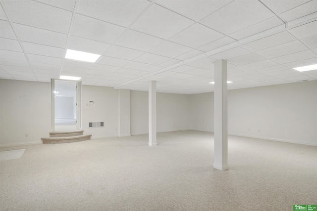 basement featuring a paneled ceiling