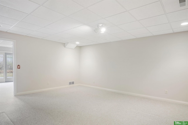 empty room featuring a paneled ceiling