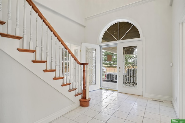 foyer featuring light tile patterned floors