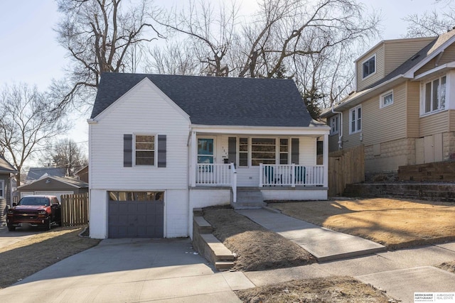 view of front of property with a porch and a garage