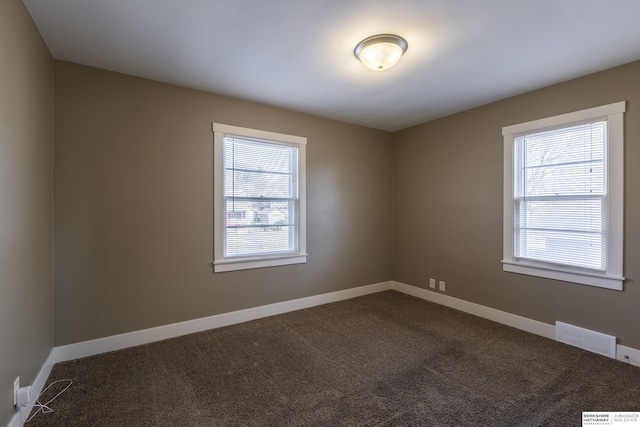 unfurnished room with carpet floors