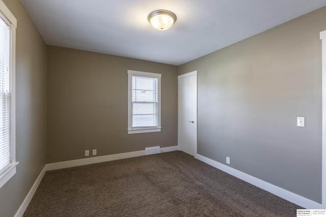 unfurnished room featuring carpet floors