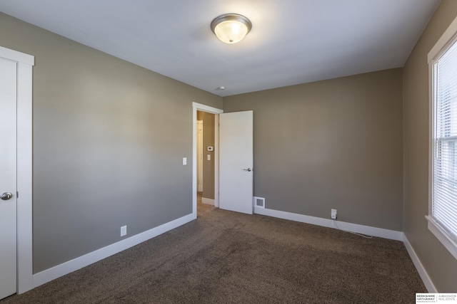 view of carpeted spare room