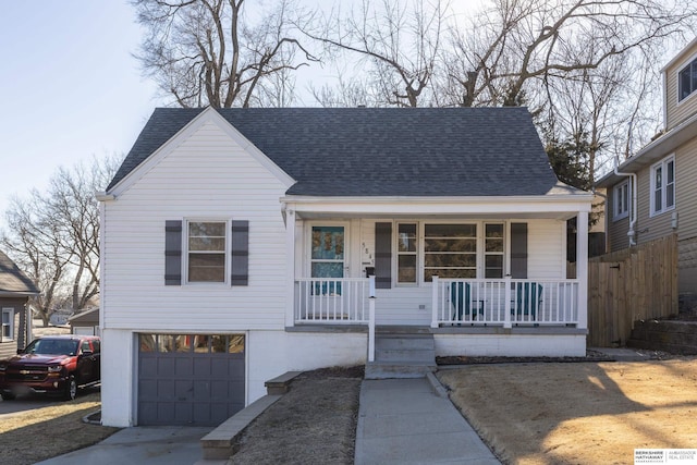 view of front of property with a porch and a garage