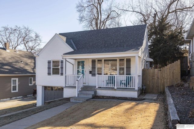 bungalow featuring a garage and covered porch