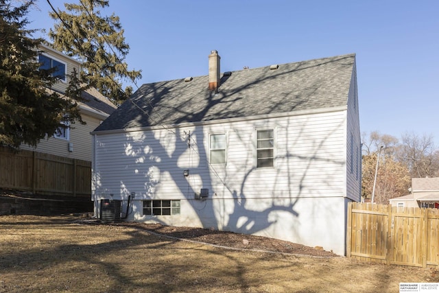 back of house featuring cooling unit