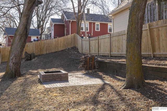 view of yard featuring a patio and a fire pit