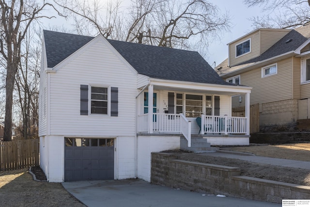 view of front of house with a garage and a porch