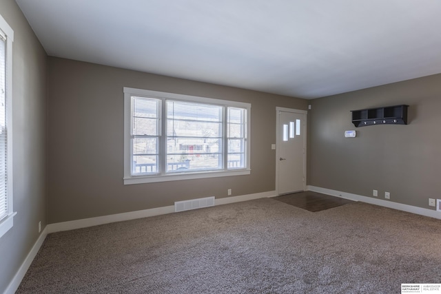 view of carpeted foyer