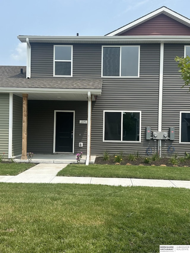 exterior space with a lawn and a porch