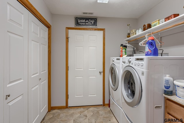 laundry room with separate washer and dryer