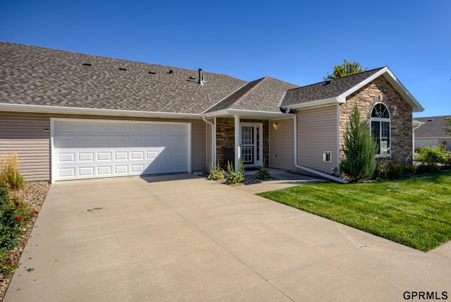 ranch-style home with a front yard and a garage