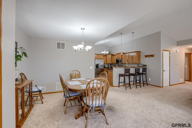 dining room featuring light colored carpet, vaulted ceiling, and a notable chandelier