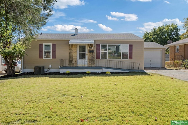 ranch-style house featuring central AC, a front lawn, and a garage