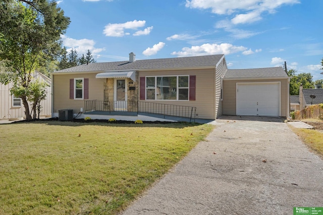 ranch-style house with a front yard, a garage, and central air condition unit