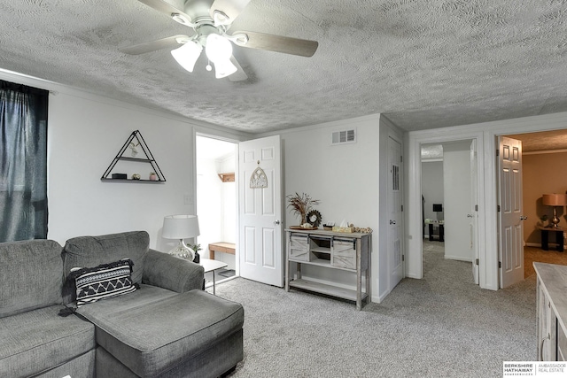 living room with ceiling fan and light colored carpet