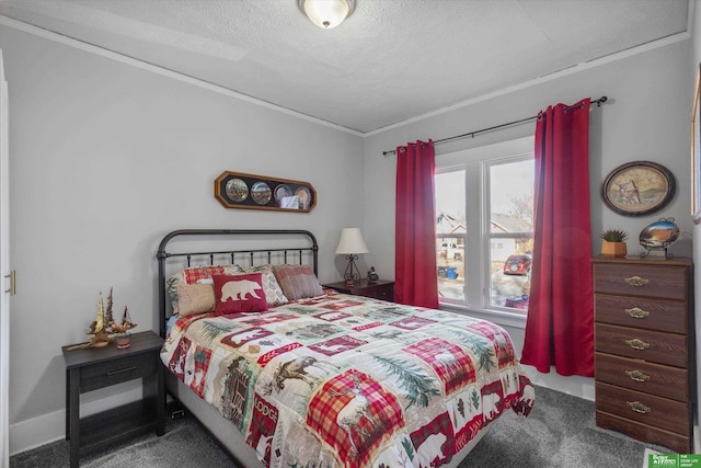 bedroom featuring a textured ceiling, crown molding, and carpet floors