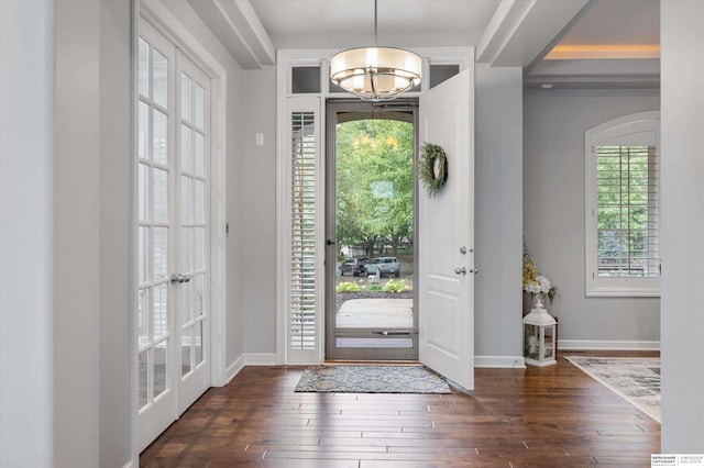 foyer featuring french doors and dark wood-type flooring