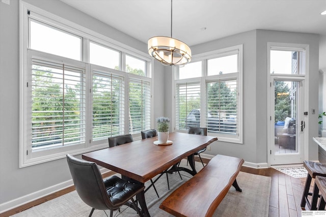 dining area with hardwood / wood-style flooring and a wealth of natural light