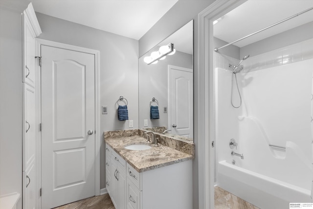 bathroom featuring vanity and shower / washtub combination