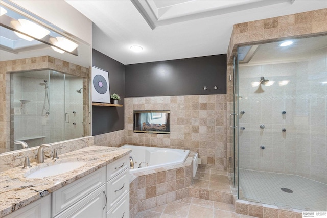 bathroom with separate shower and tub, tile patterned flooring, vanity, and tile walls