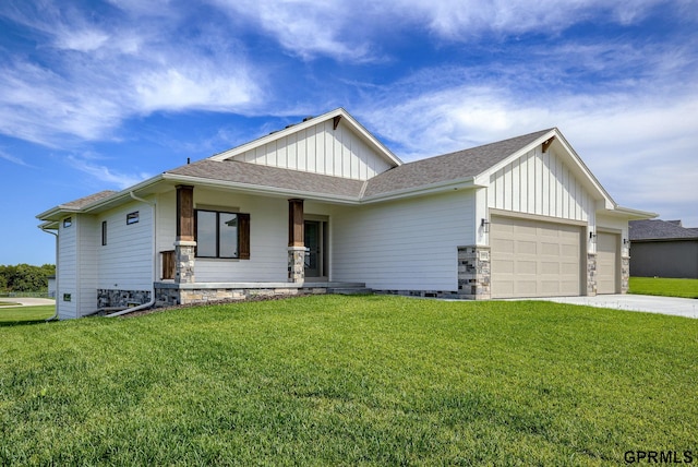 view of front of property with a front yard, a garage, and covered porch