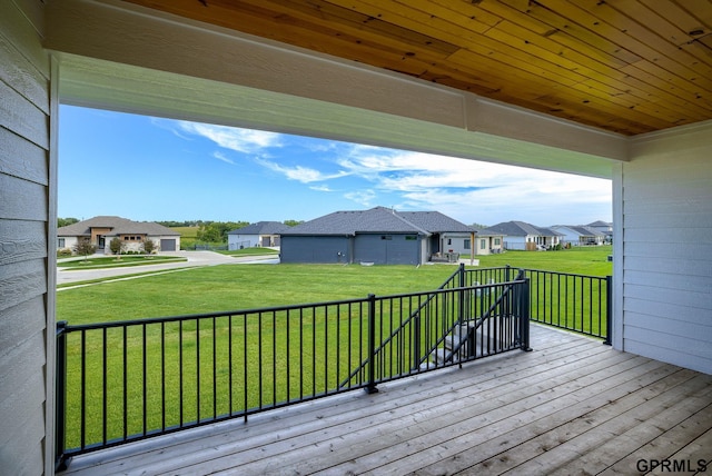 wooden deck with a yard