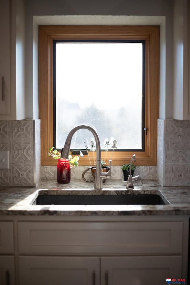 interior details with sink and tasteful backsplash