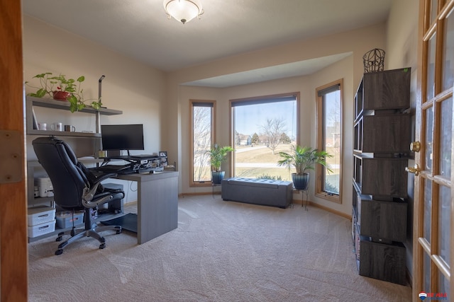 office area with french doors and light colored carpet