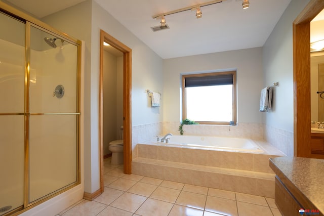 full bathroom with tile patterned flooring, vanity, toilet, and independent shower and bath