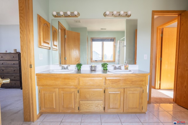 bathroom featuring tile patterned floors and vanity