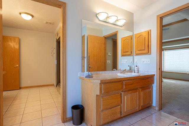 bathroom featuring tile patterned floors and vanity