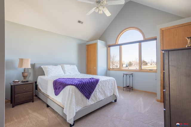 bedroom featuring ceiling fan, lofted ceiling, and light carpet