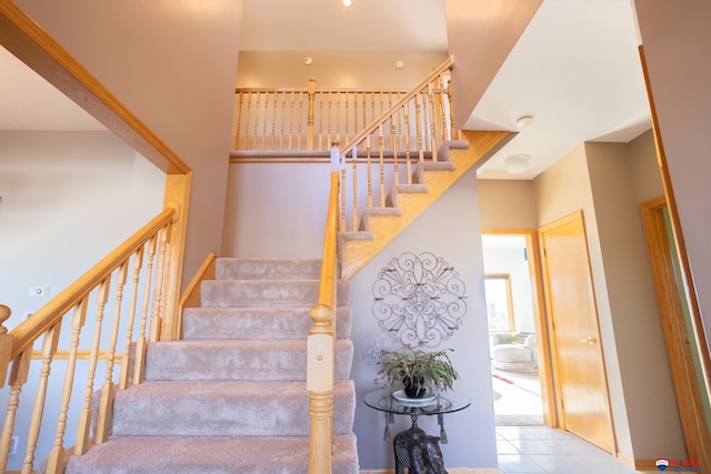 stairs with tile patterned floors