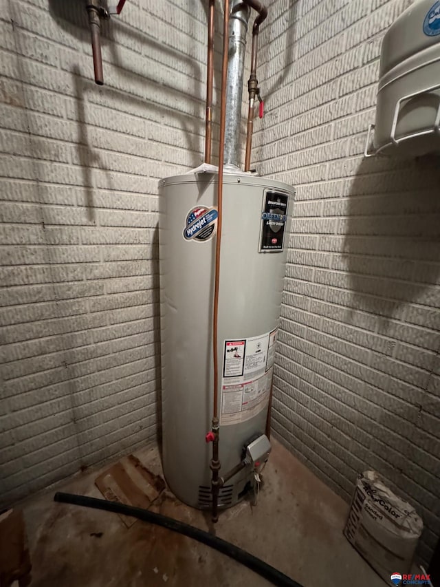 utility room with water heater