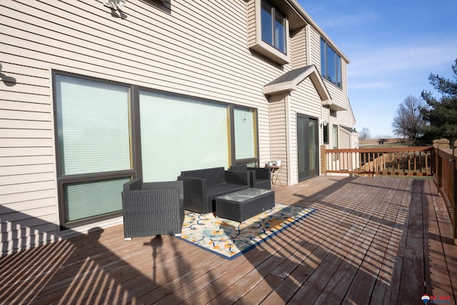 wooden terrace featuring an outdoor hangout area