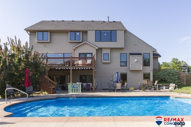 back of house with a patio area and a fenced in pool