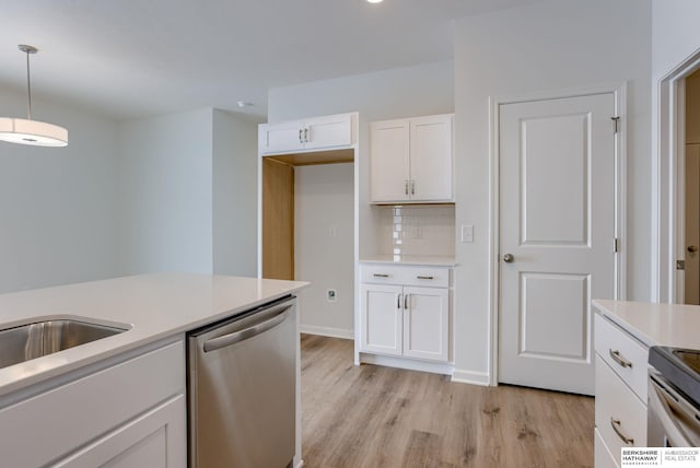 kitchen with backsplash, white cabinets, stainless steel dishwasher, light wood-type flooring, and decorative light fixtures