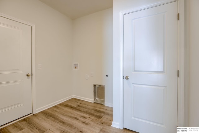 laundry area with hookup for an electric dryer, light wood-type flooring, and washer hookup