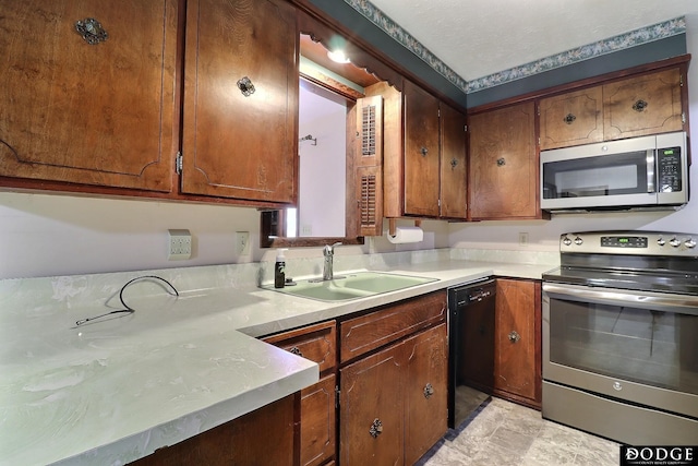 kitchen featuring appliances with stainless steel finishes and sink