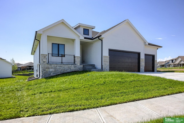 view of front of house featuring a garage and a front lawn