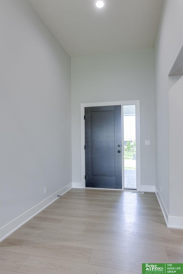 entryway with light hardwood / wood-style floors