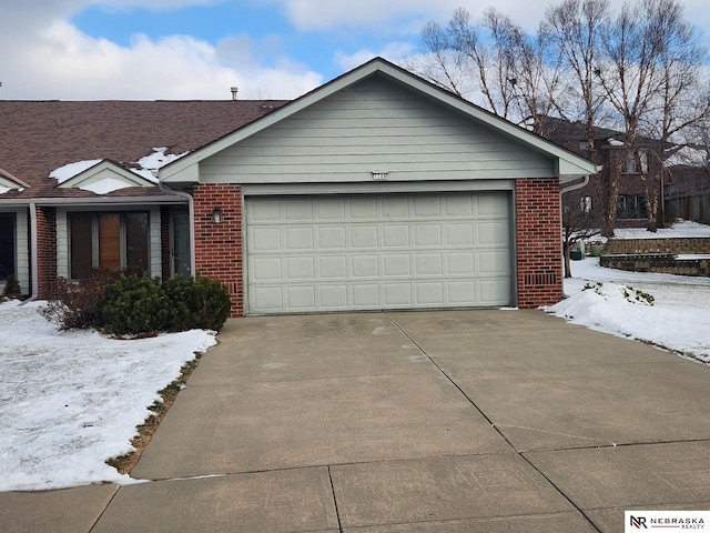 ranch-style house featuring a garage