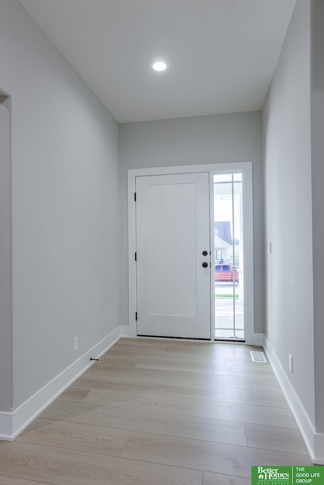 foyer with light hardwood / wood-style flooring