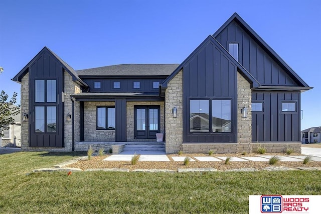 view of front of home featuring french doors and a front yard