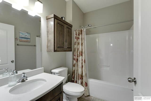 full bathroom with vanity, toilet, and shower / tub combo with curtain