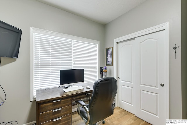 office space with light hardwood / wood-style floors