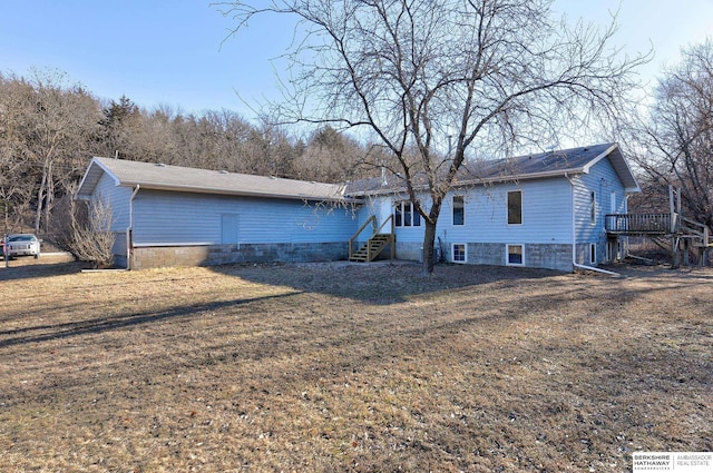 back of property featuring a yard