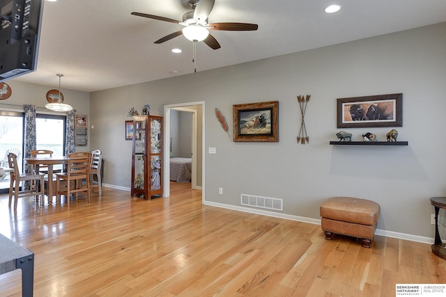 interior space featuring hardwood / wood-style floors and ceiling fan