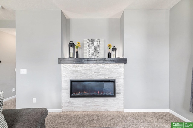 interior details featuring a fireplace and carpet